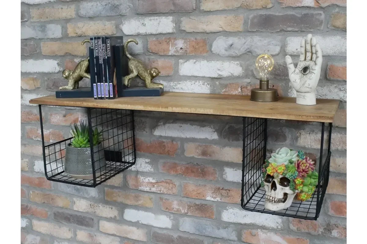 Wood and metal wall shelf with wire storage baskets, books, lamp, and decorative plants