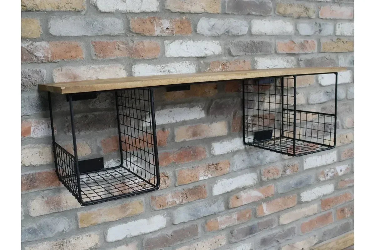 Industrial wall shelf with wood top and black wire storage baskets on brick wall
