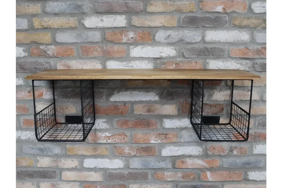 Industrial wall shelf with wooden top and two metal wire baskets mounted on brick wall