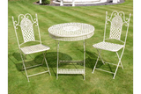 Cream metal garden bistro set with round table and two chairs on lawn
