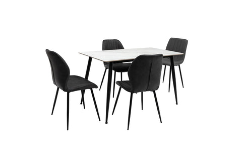 Modern dining table set with white top and four black upholstered chairs on black metal legs