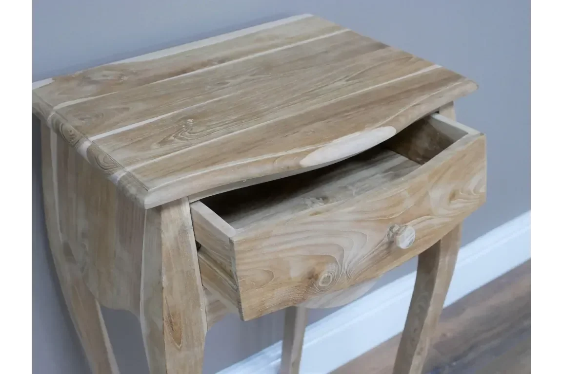 Natural wood bedside table with single drawer partially open