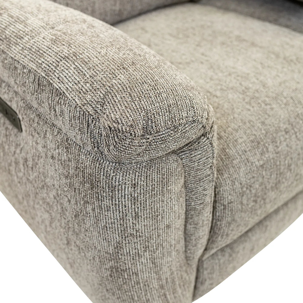 Close-up of a light gray textured fabric recliner chair showing the armrest, seat cushion, and upholstery detail on a white background.