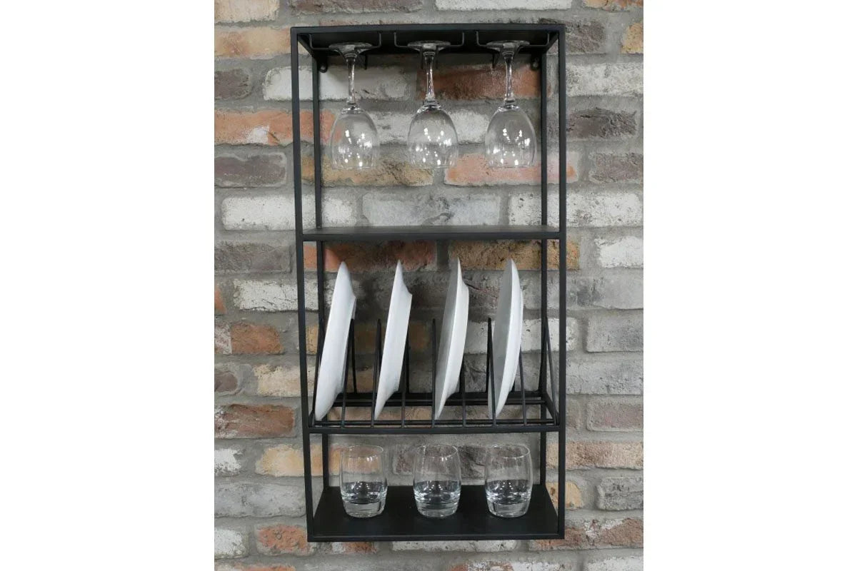 Wall mounted metal kitchen rack with wine glasses, plates and tumblers on brick background