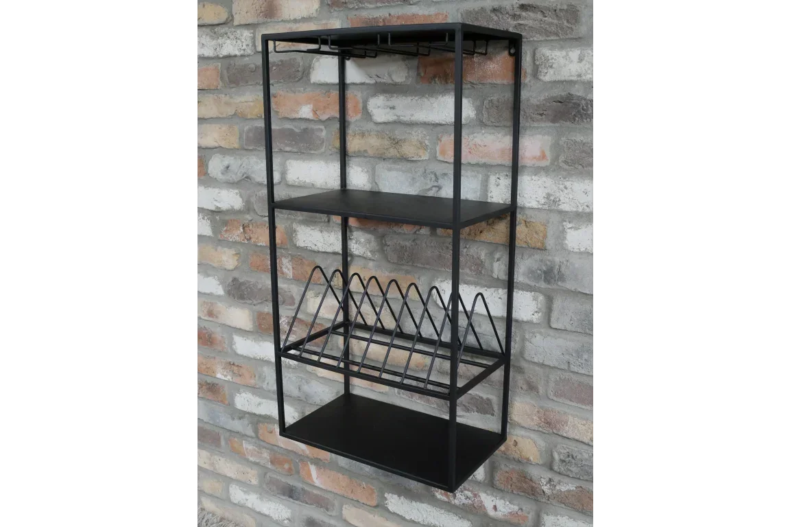 Black metal wall shelf with rack and hooks mounted on brick wall