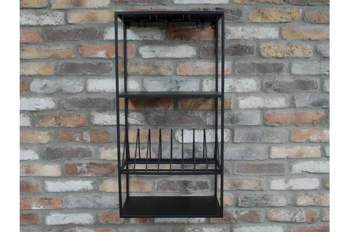 Black metal wall-mounted kitchen rack with shelves and plate holder on brick wall