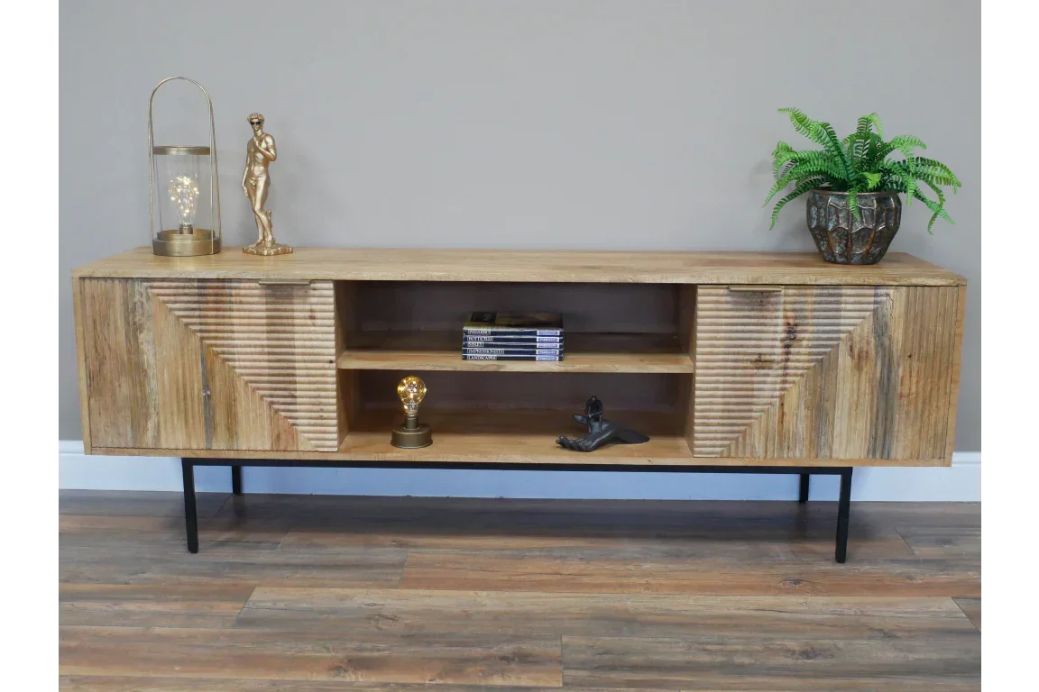 Wooden sideboard with geometric carved doors, open shelves, and black metal legs