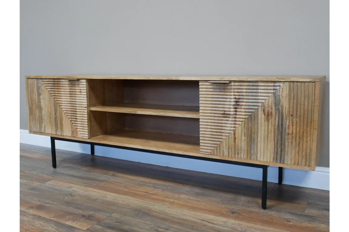 Wooden sideboard with grooved doors, open shelves and black metal legs on wood floor