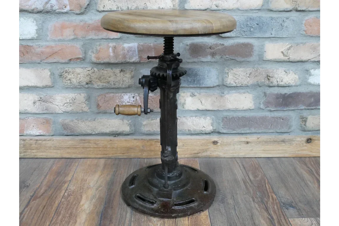 Industrial bar stool with round wooden seat and black metal adjustable base