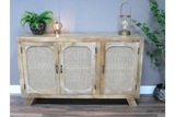 Light oak sideboard with rattan doors, black handles and decorative accents on top