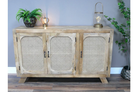 Light oak sideboard with rattan doors, black handles and decorative accents on top