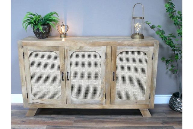 Light oak sideboard with rattan doors, black handles and decorative accents on top