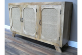Light wood sideboard with three cane panel doors and angled legs on wooden floor