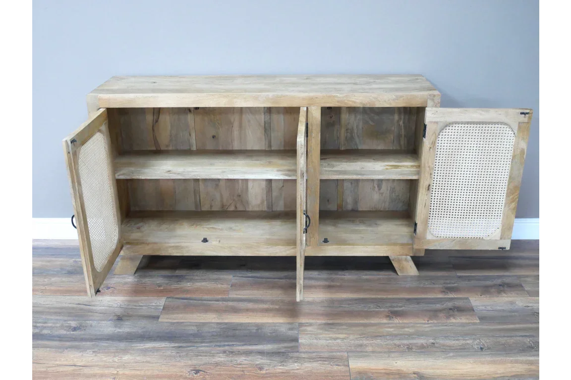 Wooden sideboard with two open cane panel doors and interior shelf on hardwood floor