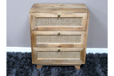 This small chest of drawers features a natural wood finish with three woven rattan front drawers and round brass knobs, perfect for stylish storage in any room