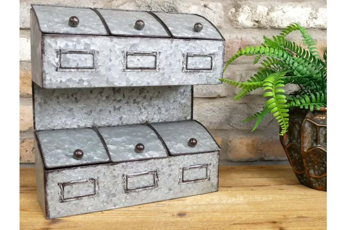 Galvanized metal storage organiser with six compartments on wooden surface