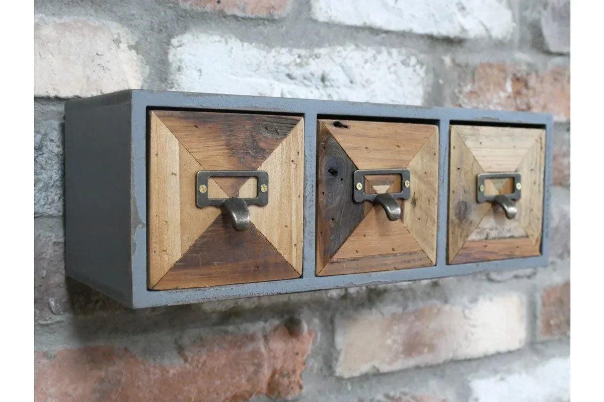 Industrial wall-mounted storage unit with three wooden drawers and metal handles