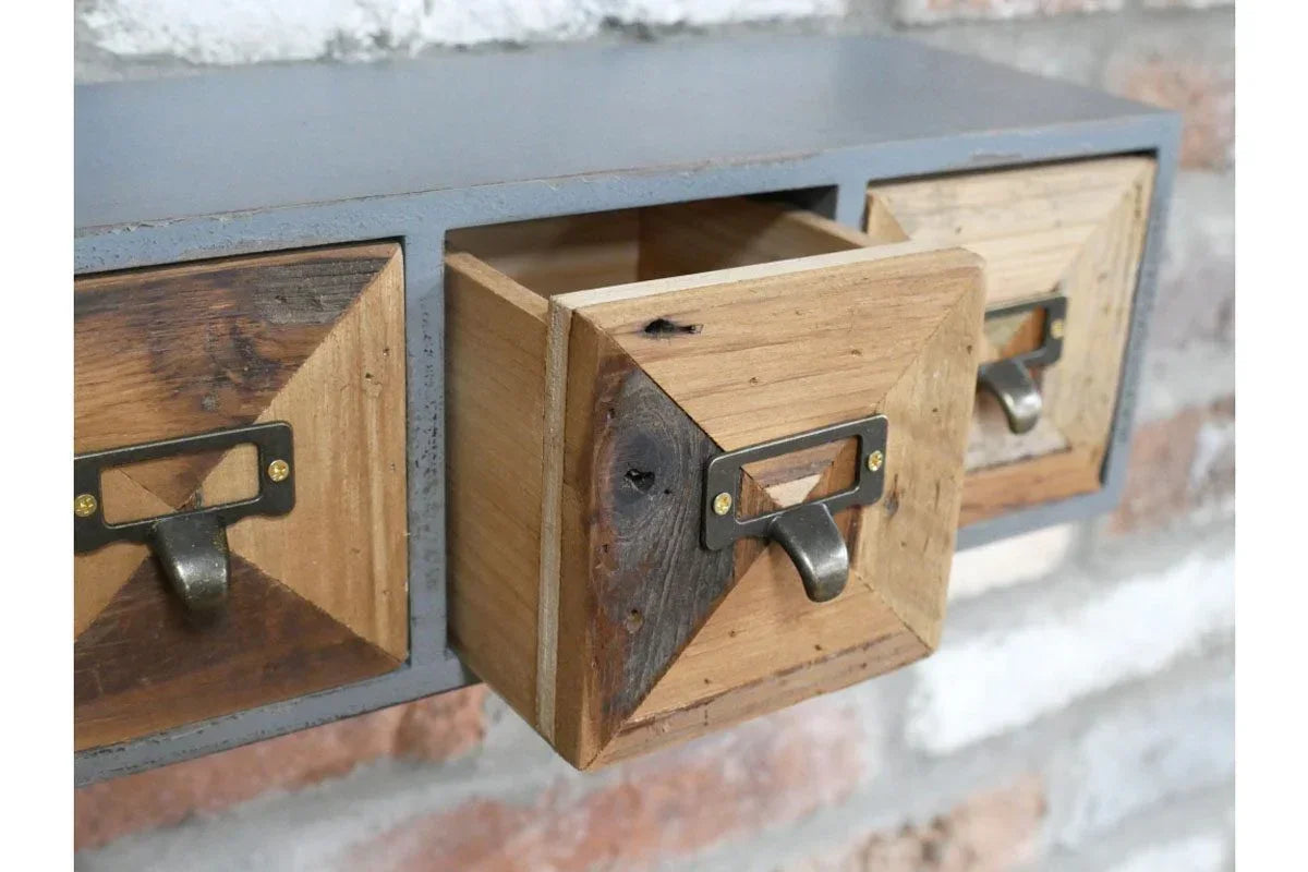 Close up of wooden storage drawers with metal handles and industrial detailing
