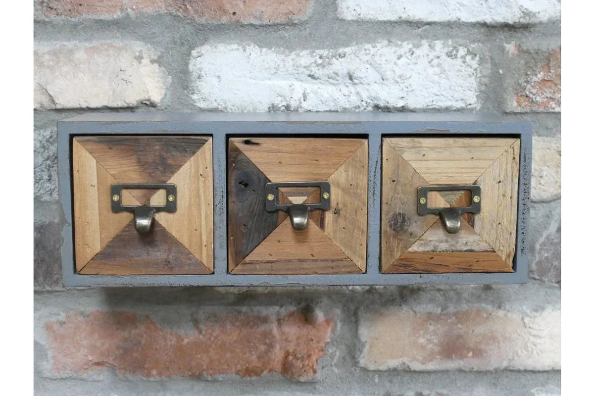 Wall mounted wooden storage drawers with metal handles and geometric fronts