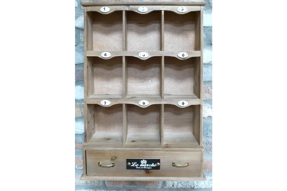 Wooden wall shelf with nine numbered cubby compartments and a drawer with brass handles