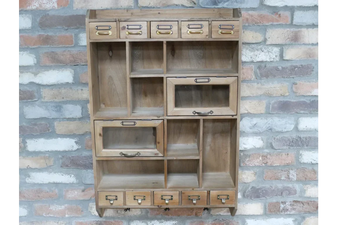 Rustic wooden wall storage unit with nine drawers and open shelves against brick wall