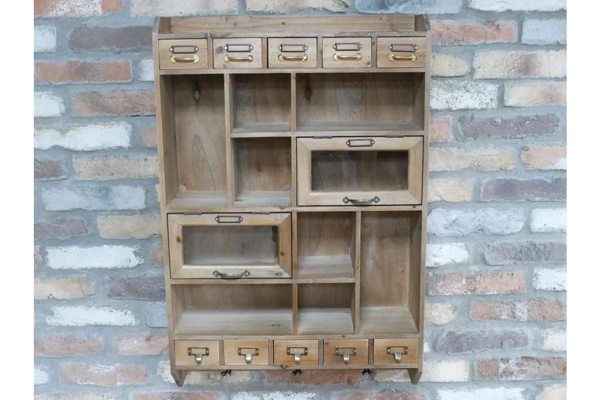 Rustic wooden wall shelf unit with multiple drawers and compartments against brick wall