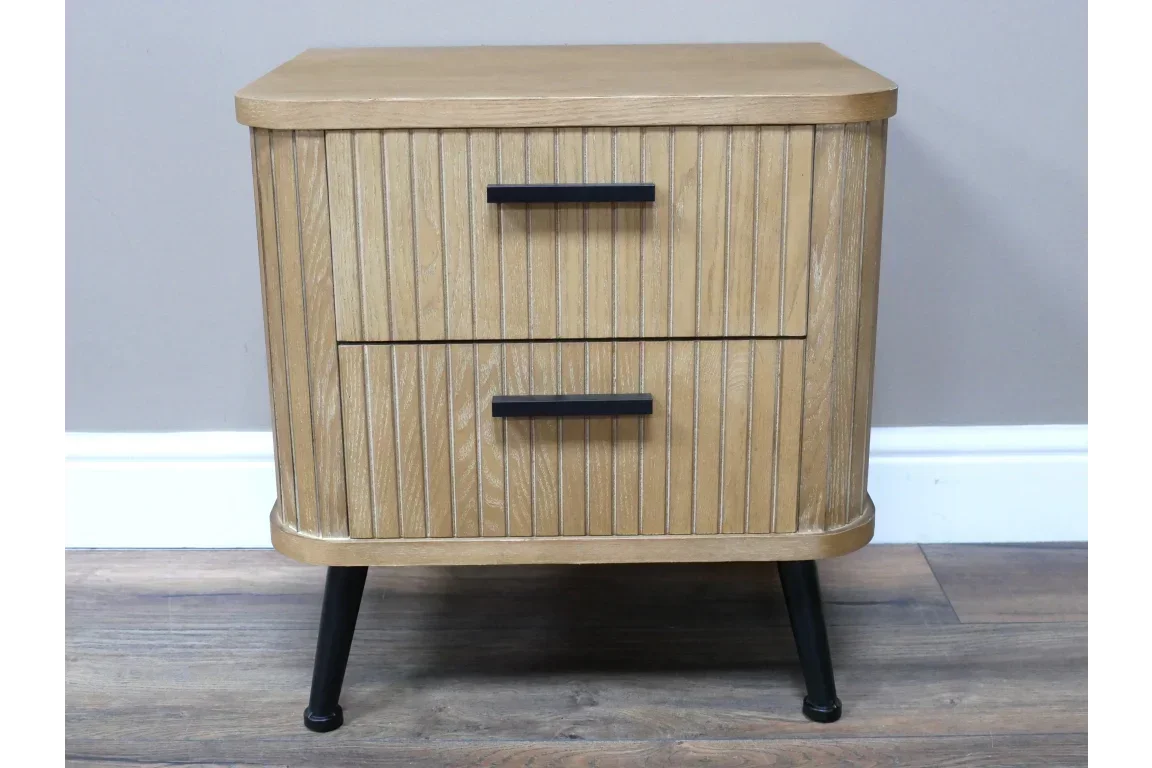 Oak bedside table with two drawers, vertical wood slats, black metal legs and handles