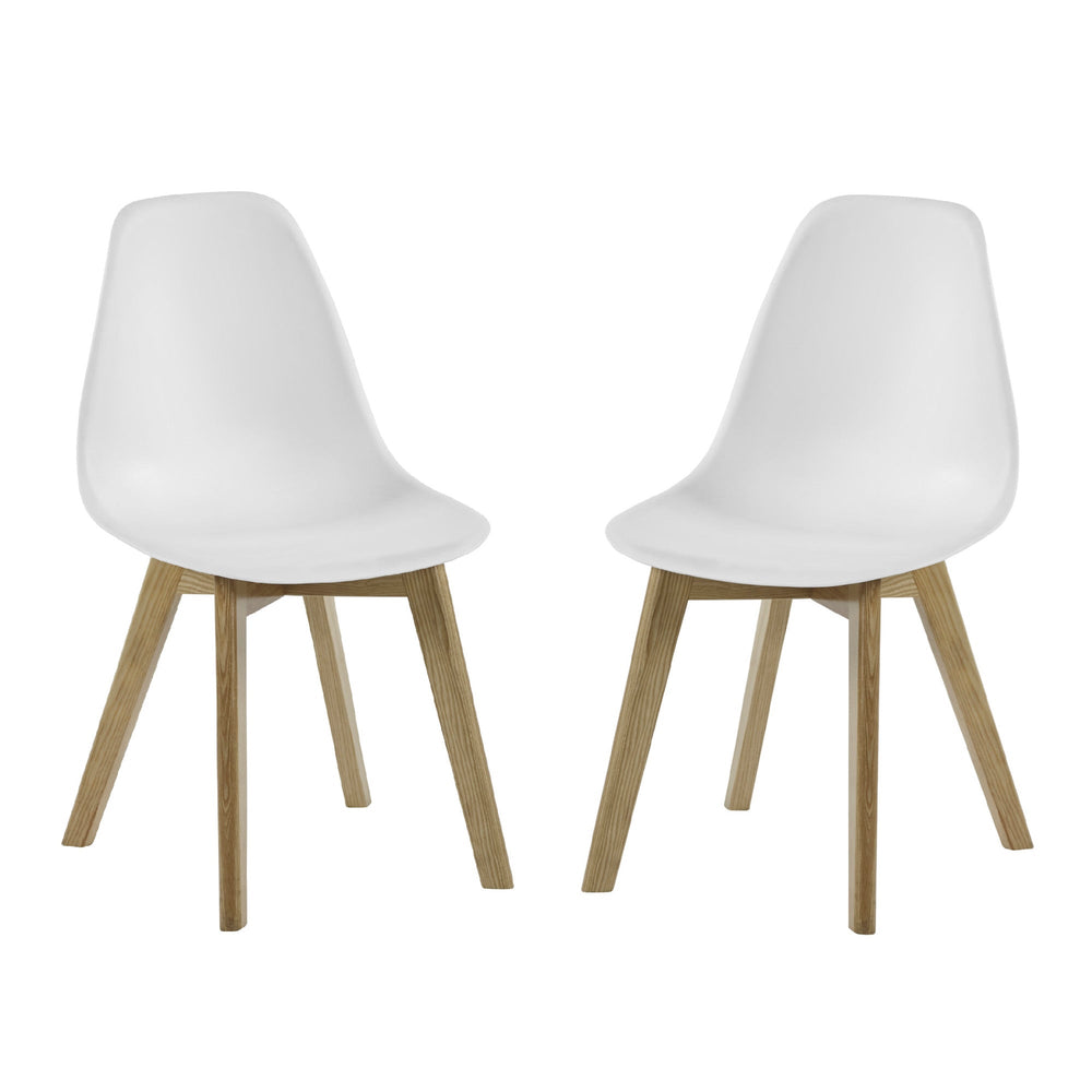 Front view of two white dining chairs with molded seats and angled wooden legs on white background