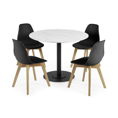 Four black chairs with wooden legs around round white marble table with black pedestal base on white background