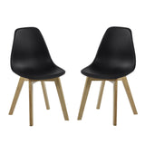 Pair of dining chairs with black curved seats and light wood legs on white background.