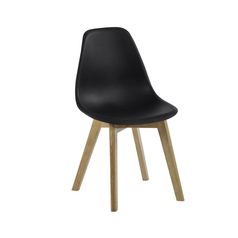 Dining chair with matte black curved seat and natural wooden legs angled side view on white background.