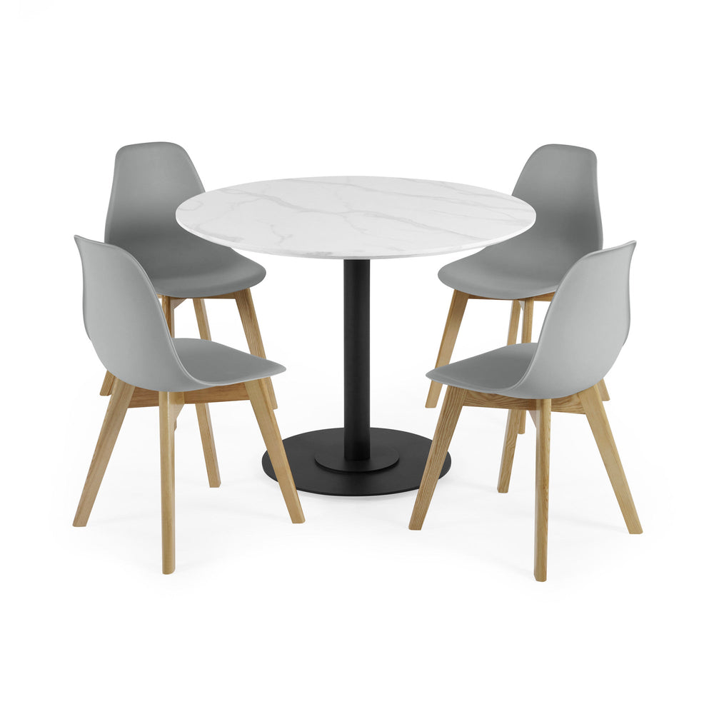 Dining set with four grey chairs and round white tabletop with black pedestal base