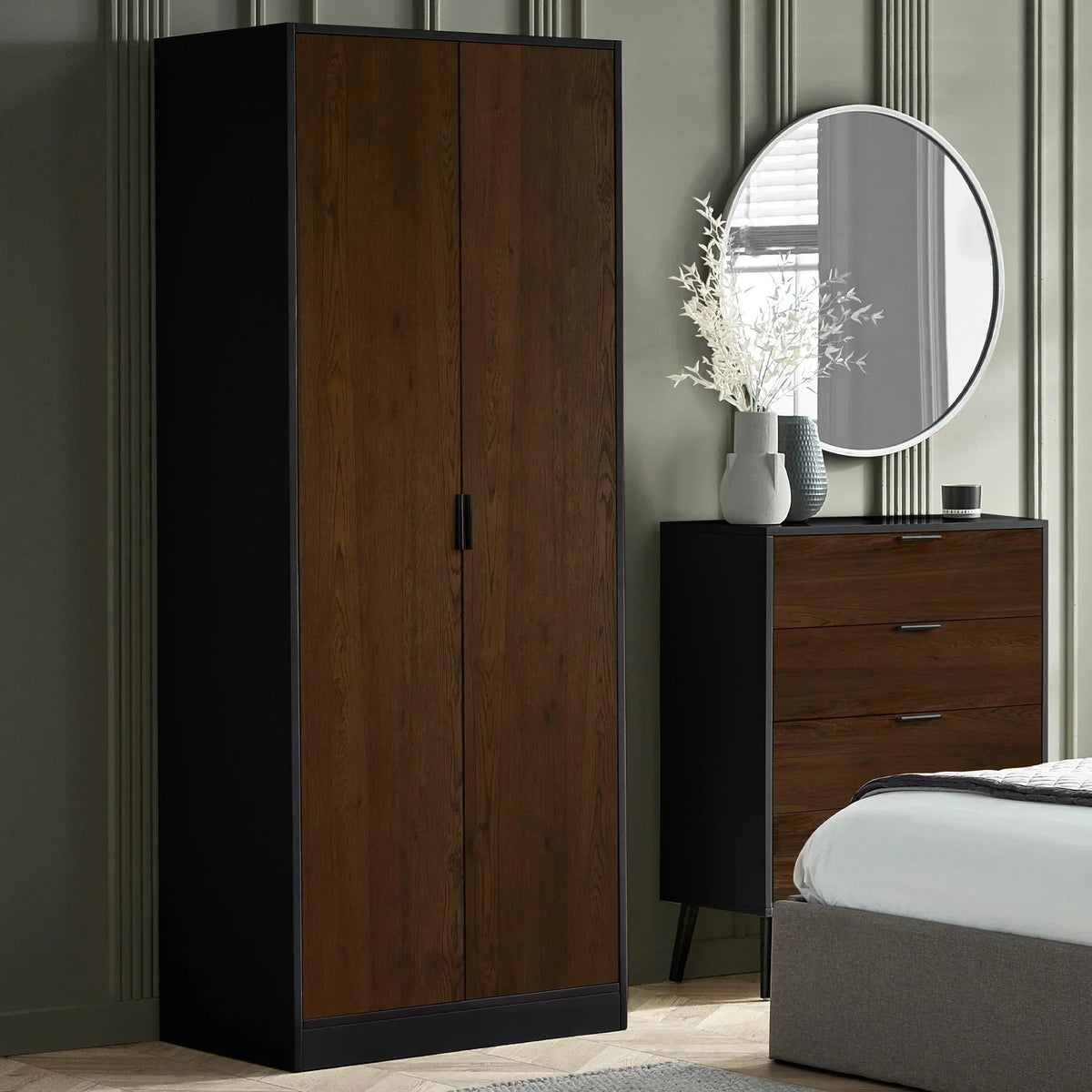 Walnut black 2 door wardrobe next to matching chest of drawers in modern bedroom