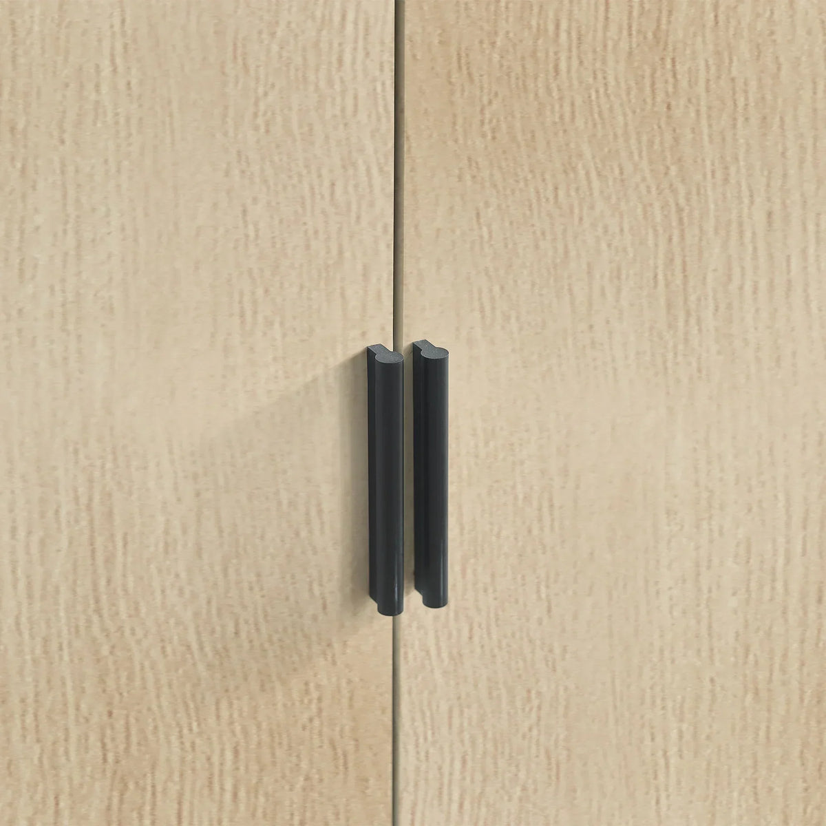 Close-up of oak wardrobe doors with black vertical handles