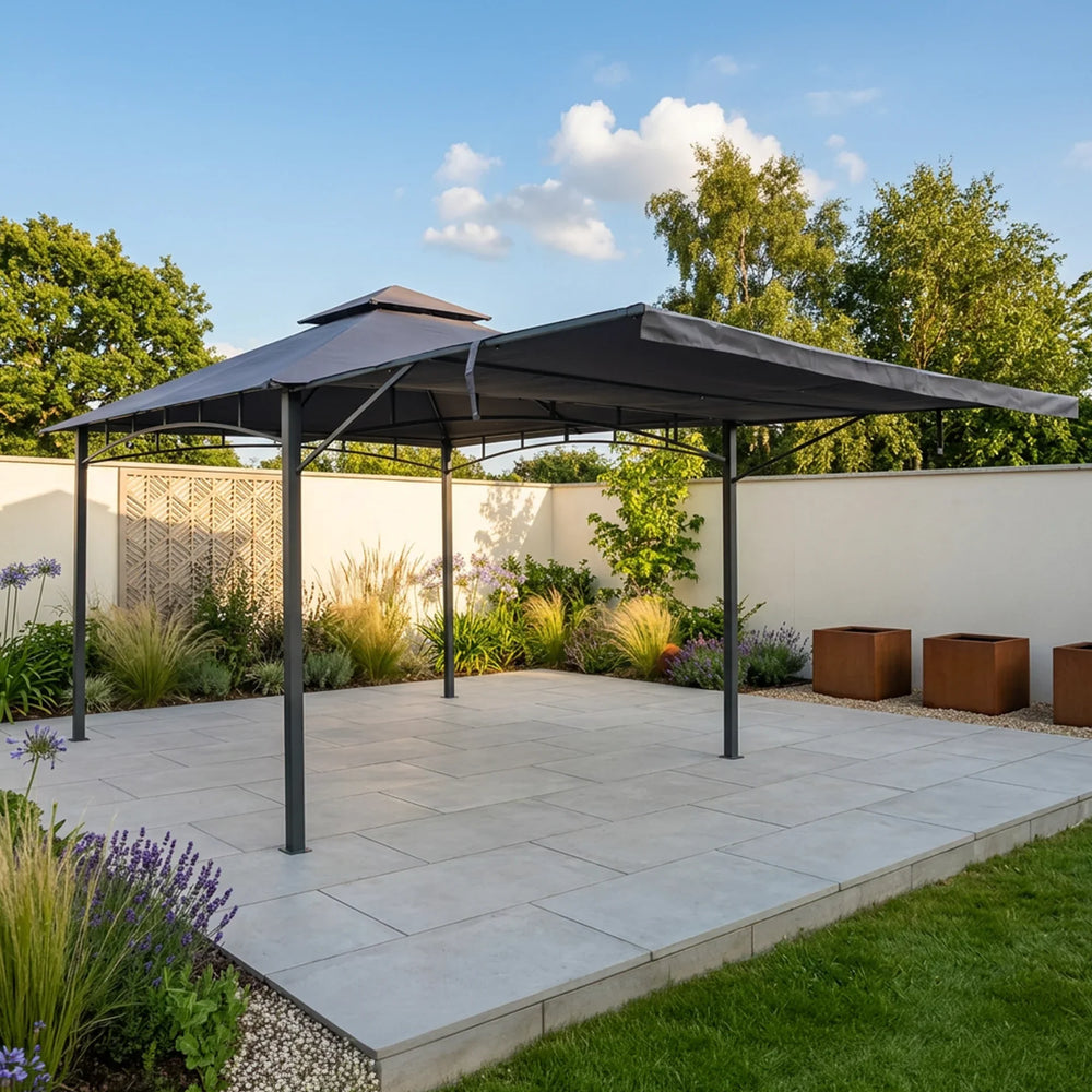 Grey metal garden gazebo with canopy on paved patio surrounded by plants
