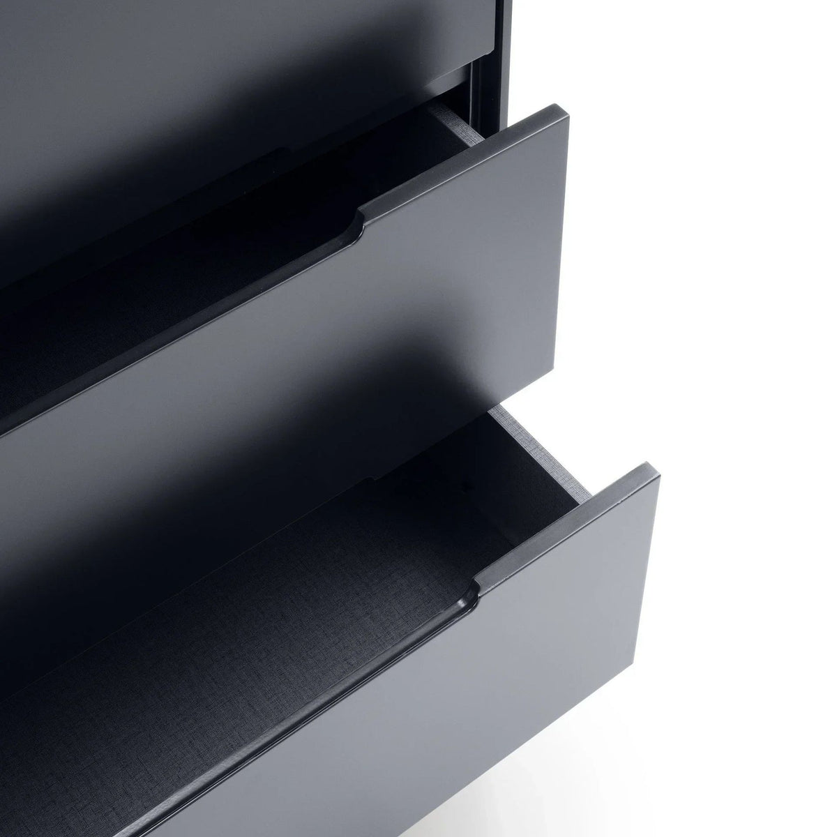 Close-up of two open anthracite grey drawers with a fabric-lined interior