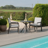 Aluminium garden bistro set with two grey cushioned chairs and round table beside pool