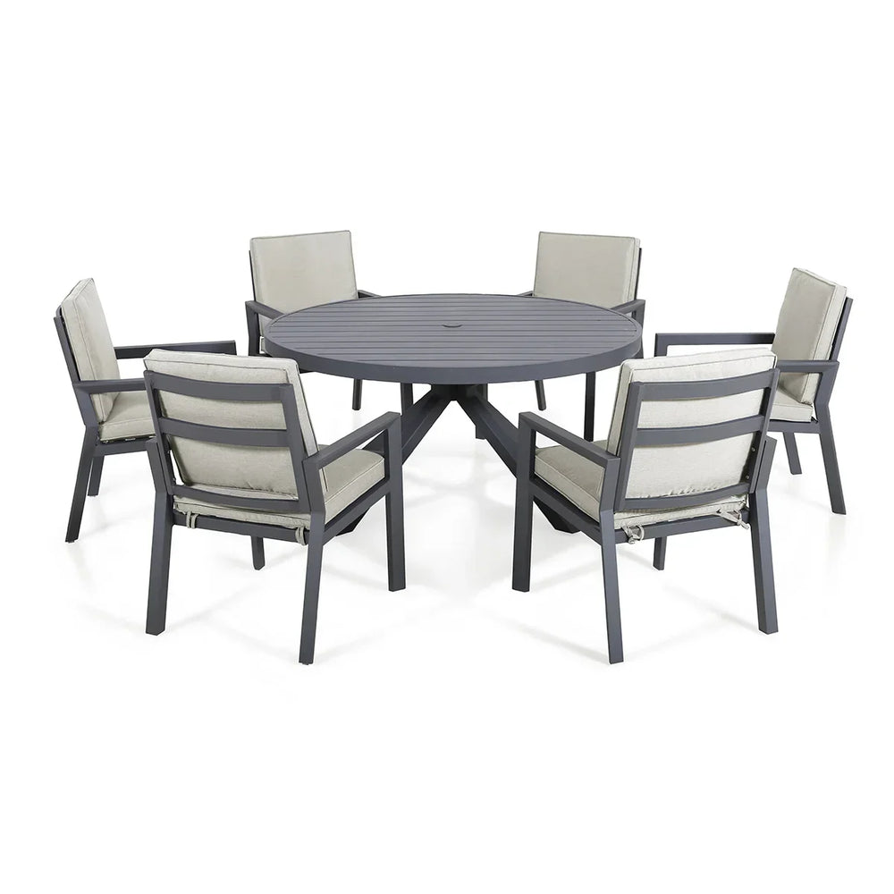 Grey aluminum outdoor dining set with round table and six cushioned chairs