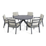 Grey aluminum outdoor dining set with round table and six cushioned chairs