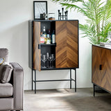Chevron wood drinks cabinet with black frame, open to display glassware and bottles