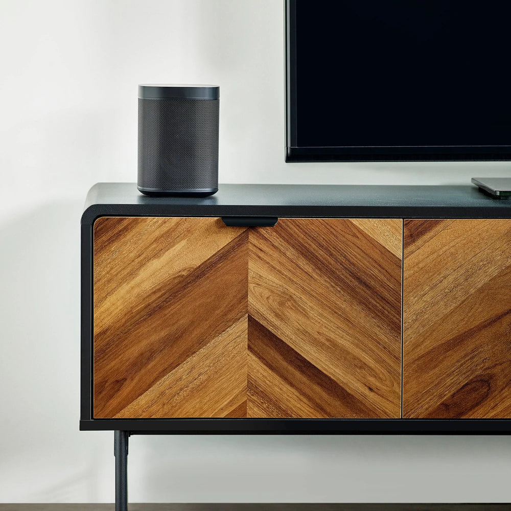 Chevron wood sideboard with black metal frame and speaker on top, modern living room furniture