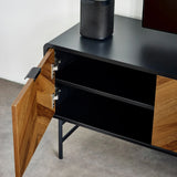Black and wood TV unit with open cabinet door, two shelves and metal legs on grey floor