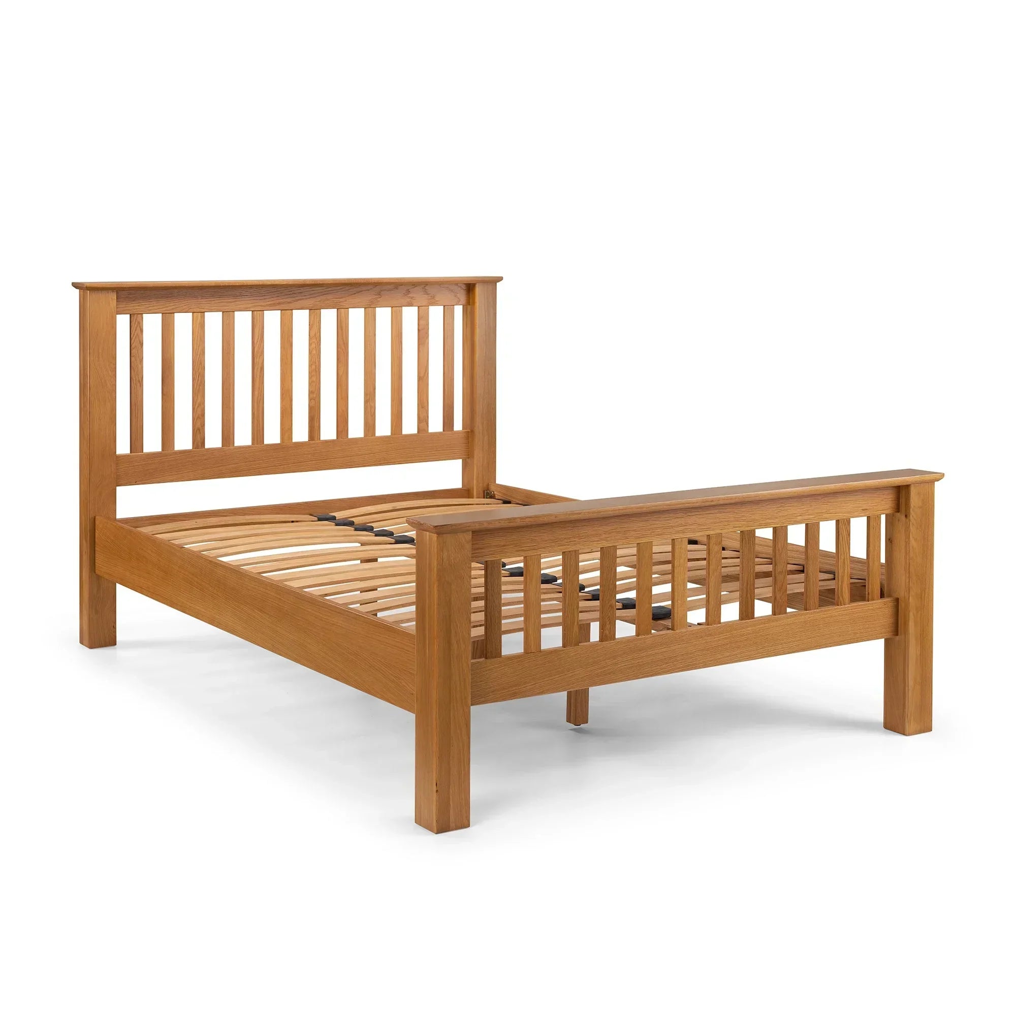 Wooden oak bed frame with slatted headboard and footboard on white background