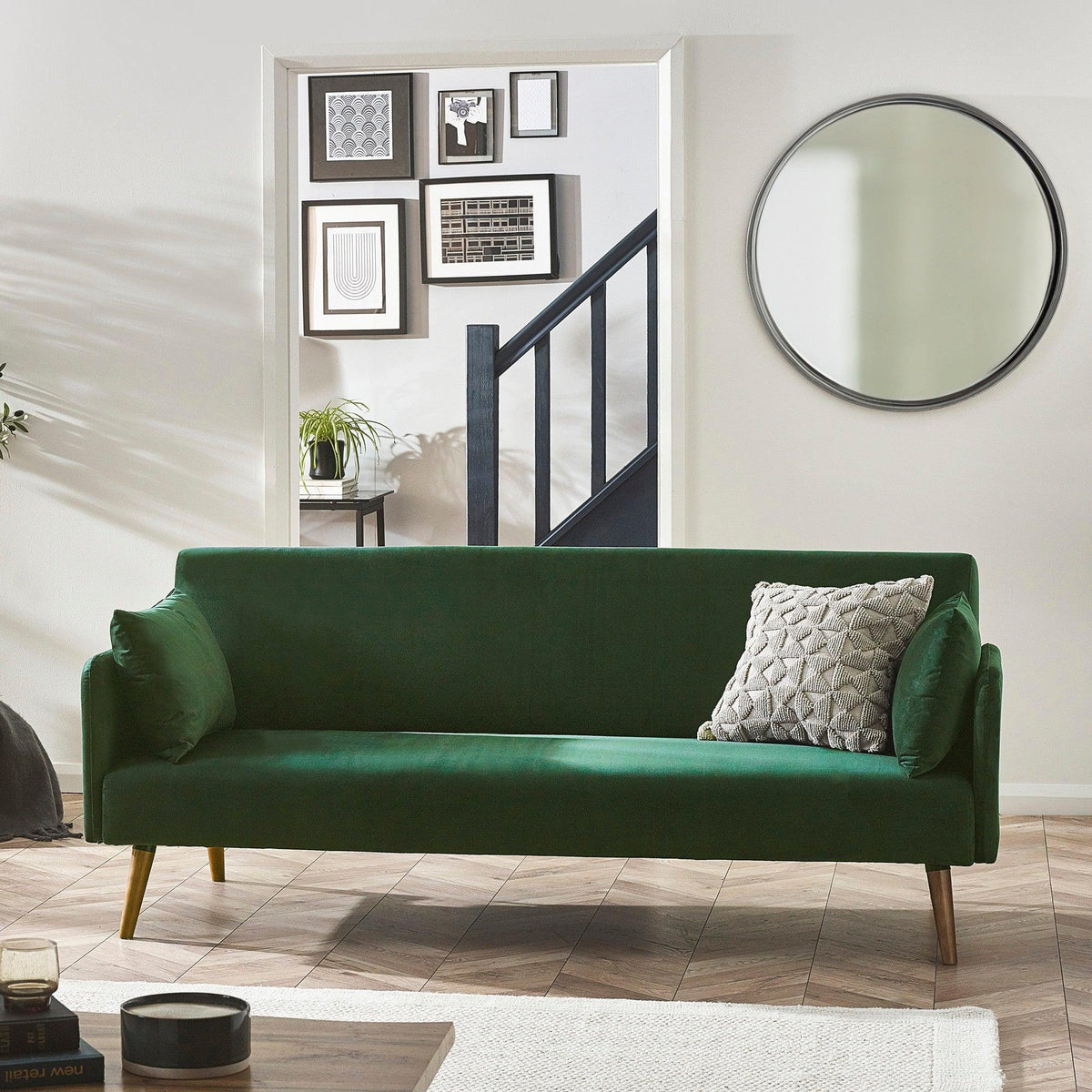 Green sofa bed with wooden legs and textured cushion in modern living room