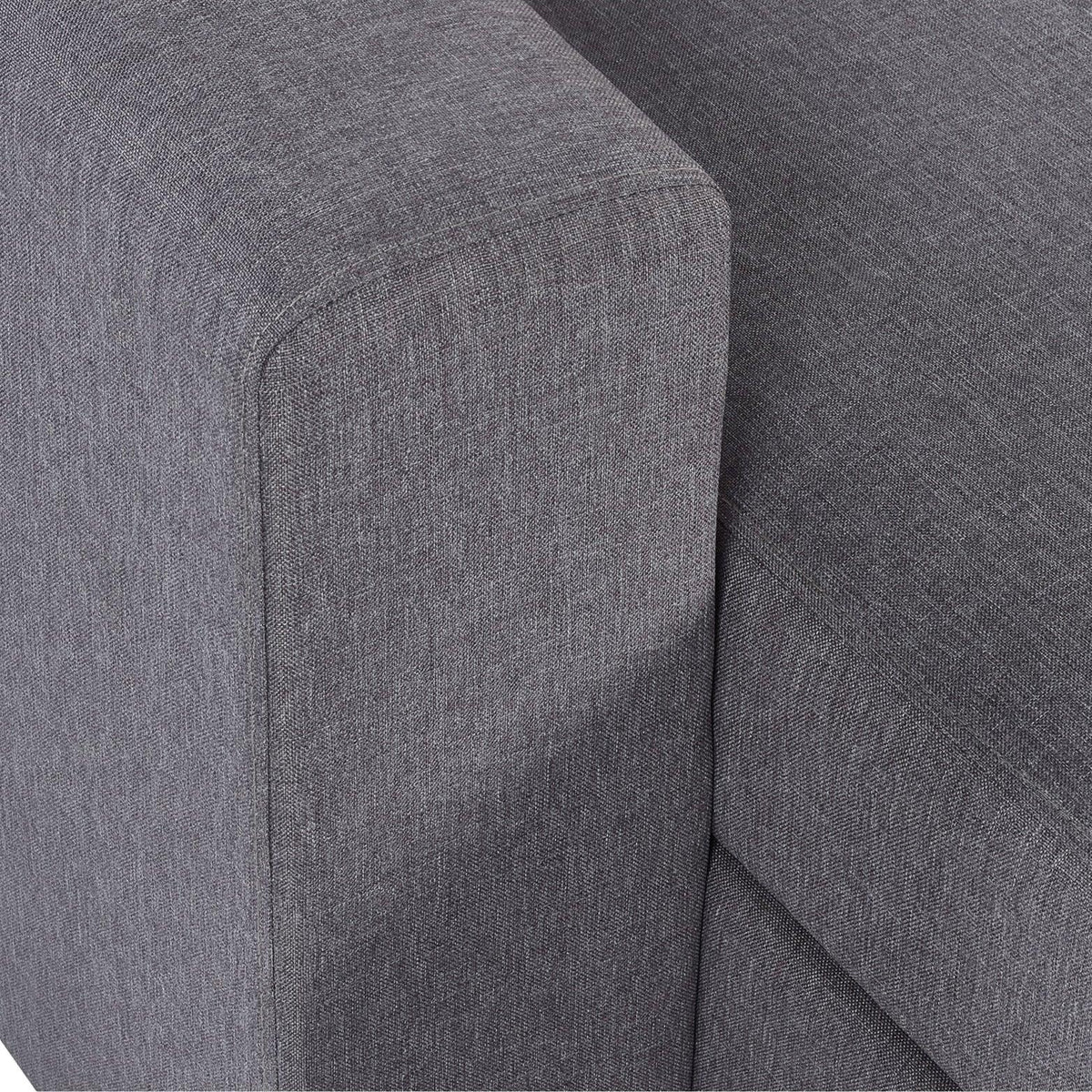 Close-up of grey fabric sofabed armrest and seat cushion