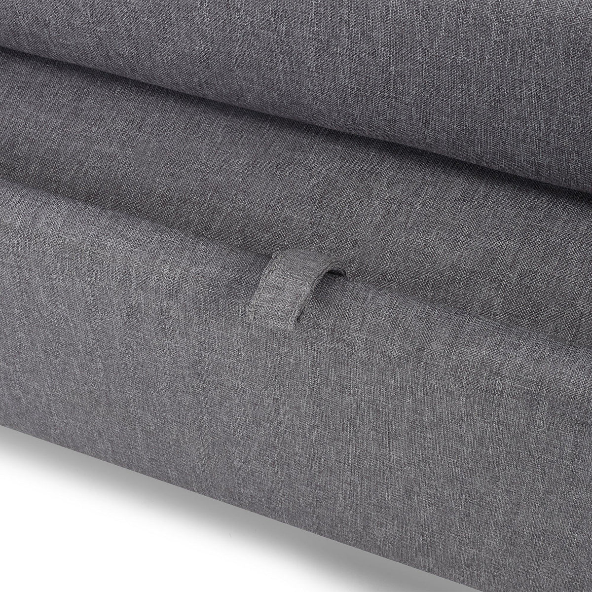Closeup of grey fabric sofabed storage handle detail