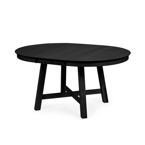 Extended black round wooden dining table with four legs crossed in studio against white background
