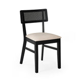 Single black dining chair with natural fabric seat and woven rattan backrest on plain white background