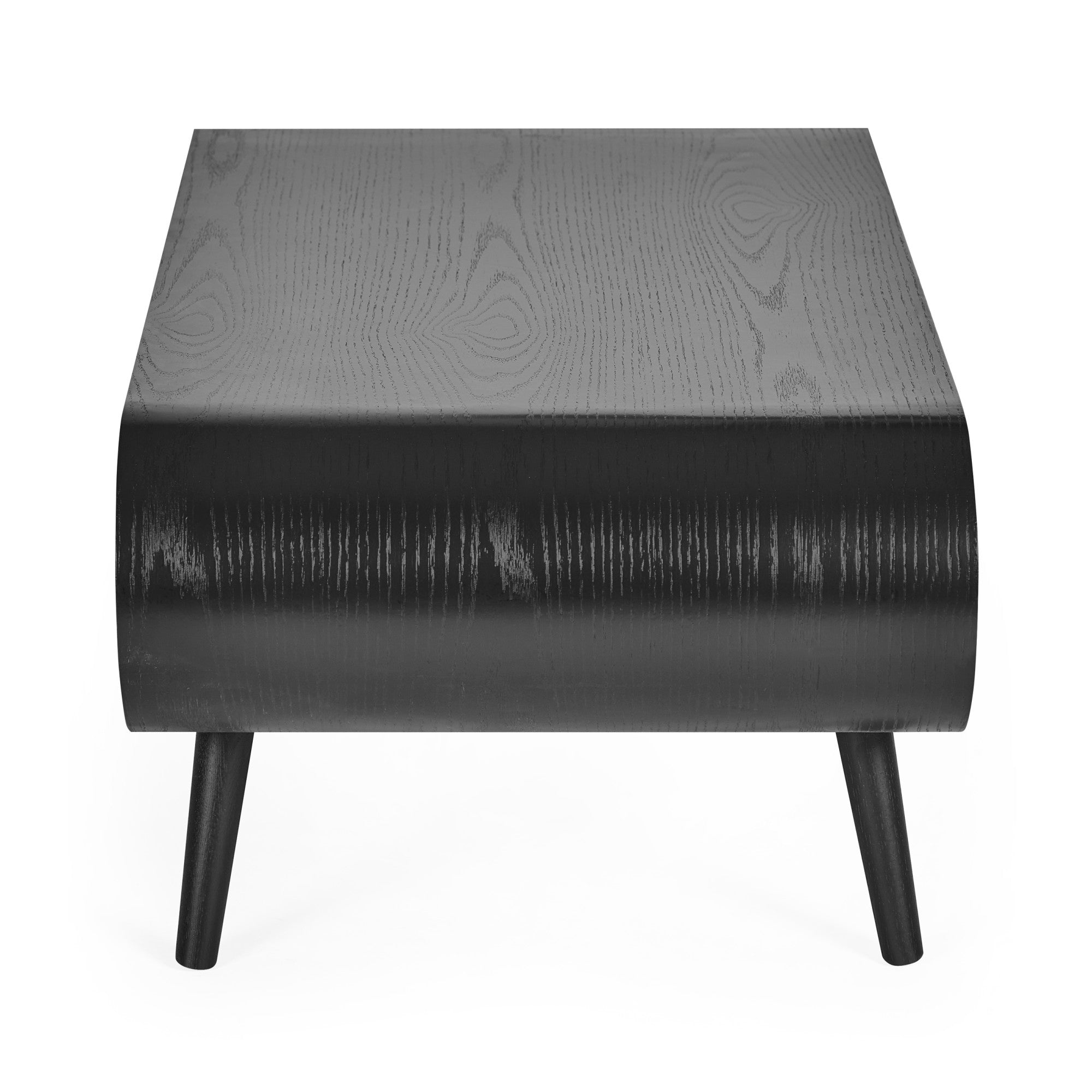 Close-up of black wood curved edge of coffee table showing wood grain texture and tapered leg