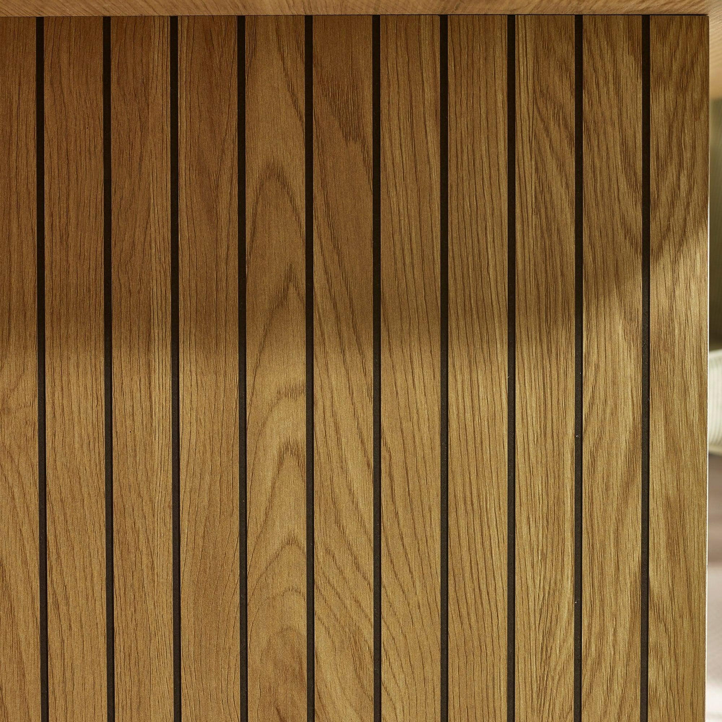 Oak wood slatted panel with vertical lines and natural grain detail